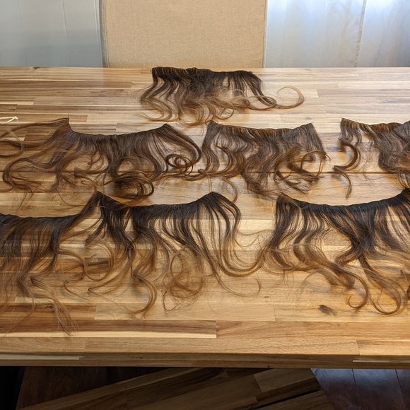 Human hair extensions wefts